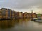 Amsterdam canal Singel with typical dutch houses and tourist boats