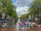 Amsterdam canal with typical dutch houses and houseboats, boats