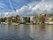 Amsterdam canal with typical dutch houses and houseboats, boats etc