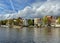 Amsterdam canal with typical dutch houses and houseboats, boats etc