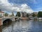 Amsterdam canal with typical dutch houses and houseboats, boats etc