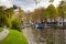 Amsterdam canal view with small boats. Spring day in the city