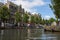 Amsterdam canals with bridges, boats and houses