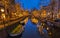 Amsterdam canals with Christmas lights during December, canal historical center Amsterdam at night