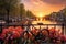 Amsterdam canals at sunset with bicycle, Beautiful sunrise over Amsterdam, The Netherlands, with flowers and bicycles on the