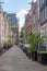 Amsterdam city paved alley. Brick wall house and bicycle parked in front, Holland Netherlands