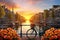 Amsterdam cityscape with bicycle and flowers at sunrise, Netherlands, Beautiful sunrise over Amsterdam, The Netherlands, with