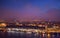 Amsterdam cityscape top view at dusk. River with ships, boats, Central station. Sightseeing of Dutch