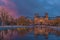 Amsterdam in a cold night during spring season. Famous national Rijks museum general view reflecting in tha water at dusk