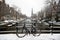 Amsterdam covered with snow with the Westerkerk in Netherlands