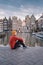 Amsterdam Damrak during sunset, happy man on a autumn evening at the canals