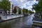 Amsterdam,Holland,August 2019. In the historic center a view that is a symbol of the city: a blue houseboat moored on the edge of