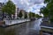 Amsterdam,Holland,August 2019. In the historic center a view that is a symbol of the city: a blue houseboat moored on the edge of