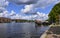 Amsterdam, Holland, August 2019. View of the Amstel River, outskirts of the city. A large moored boat is used as a houseboat.