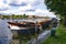 Amsterdam, Holland, August 2019. View of the Amstel River, outskirts of the city. A large moored boat is used as a houseboat.