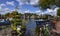 Amsterdam, Holland, August 2019. View of the Amstel River, outskirts of the city. A large moored boat is used as a houseboat.