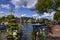 Amsterdam, Holland, August 2019. View of the Amstel River, outskirts of the city. A large moored boat is used as a houseboat.