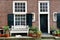 Amsterdam, Holland - nice view of a building facade, a white bench and a cat