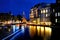 Amsterdam, Holland - scenic view of a canal and buildings at night