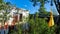 Amsterdam Houseboats on the banks of the Amstel River with colorful festivity flags and sun