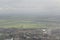 Amsterdam industrial outsider zone with green countryfield viewed from an airplane