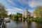 Amsterdam mansion and canal streetscape