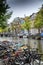 Amsterdam, Netherlands, 10/12/2019: Parked bicycles on a canal in the city center.