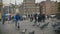 AMSTERDAM, NETHERLANDS - 16 oct 2016, Holland CAPITAL, Dam Square - children plays with doves on the historical center