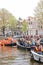 Amsterdam, Netherlands - April 27, 2019: People on party boats dressed in national orange color while celebrating the Kings day,