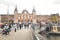 Amsterdam, Netherlands - April 27, 2019: People in the streets of the Dutch capital. Amsterdam Centraal, the buildings of the main