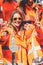 Amsterdam, Netherlands - April 27, 2019: Women on party boat dressed in national orange color celebrating the Kings day,