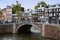 AMSTERDAM, THE NETHERLANDS - AUGUST 18, 2015: View on Prinsengracht from Spiegelgracht. Street life, Canal, pedestrians and