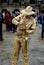 Amsterdam,Netherlands - August 8, 2018: Street artist dressed in golden clothes pretends to be a statue