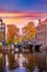 Amsterdam, Netherlands. Autumn sunset scene with scenic channels. Vector illustration. Illustrative editorial use only.