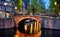 Amsterdam, Netherlands. Bridges with nighttime illumination