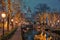 Amsterdam Netherlands canals with christmas lights during December, canal historical centre of Amsterdam at night