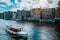 Amsterdam Netherlands dancing houses over river Amstel landmark in old european city landscape. Picturesque clouds on