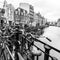 Amsterdam, The Netherlands - February 26, 2010: Bicycles on the street near water canal. Bicycle is very popular transport in