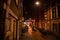 AMSTERDAM, NETHERLANDS - JANUARY 20, 2016: Night streets of Amsterdam with blurred silhouettes of passersby on January 20, 2016 in