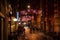 AMSTERDAM, NETHERLANDS - JANUARY 20, 2016: Night streets of Amsterdam with blurred silhouettes of passersby on January 20, 2016 in