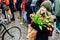 Amsterdam / Netherlands January 2020 : An young lady with colorful tulip seeds in a paper bag at Amsterdam Tulip festival