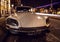 AMSTERDAM, NETHERLANDS - JANUARY 5, 2016: Vintage white car parked in center of Amsterdam at night time. January 5, 2016 in Amster