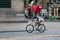 AMSTERDAM, NETHERLANDS - JUNE 25, 2017: Unknown young woman on a bicycle.