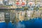 AMSTERDAM, NETHERLANDS, MARCH, 10 2018: Gorgeous view of reflecting building over river Amstel landmark in old european