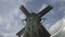 AMSTERDAM, NETHERLANDS-OCTOBER, 12, 2017: a 180p slow motion shot of a windmill at zaanse schans near amsterdam