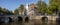 AMSTERDAM, NETHERLANDS - Sep 22, 2020: Amsterdam canal bridges and mansions with trees in autumn sunset