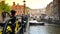 AMSTERDAM, THE NETHERLANDS: ULTRA HD 4k, Real time; Boats sail in Amsterdam canal in Amsterdam.