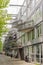 Amsterdam Oost. East side neighbourhoods. View of house facade with unusual triangle balconies hunging on the metal beams. Modern