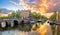 Amsterdam. Panoramic view of the downtown of Amsterdam. Traditional houses and bridges of Amsterdam. A colorful sundown time.