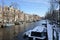 Amsterdam winter snow canal Amstel city center.